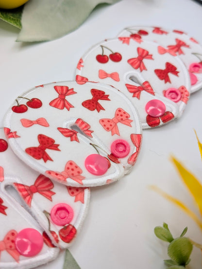 Cherries and bows star Tubie Pads